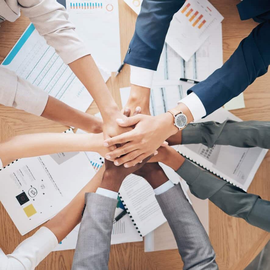 Team hands, support and work motivation of business workers working with financial data. Finance collaboration, teamwork and accounting employee group together planning a project with tax documents